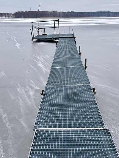 High angle view of swimming pool by sea against sky