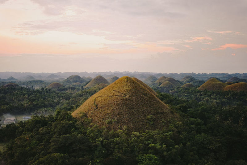 Scenic view of mountains against sky at sunset
