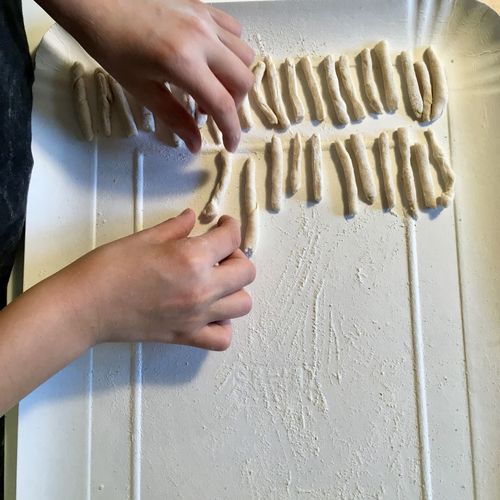 Cropped image of woman hand preparing food on table