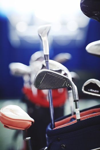 Close-up of golf clubs in bag