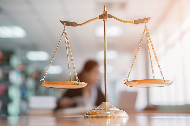 Close-up of weight scale on table in courthouse