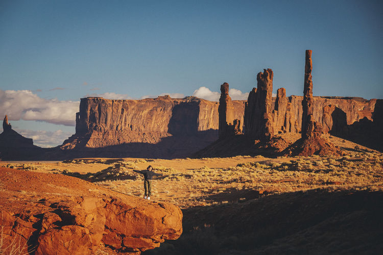 A woman is standing in monument valley, arizona