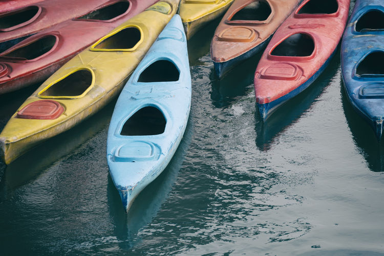 Close-up of multi colored kayaks