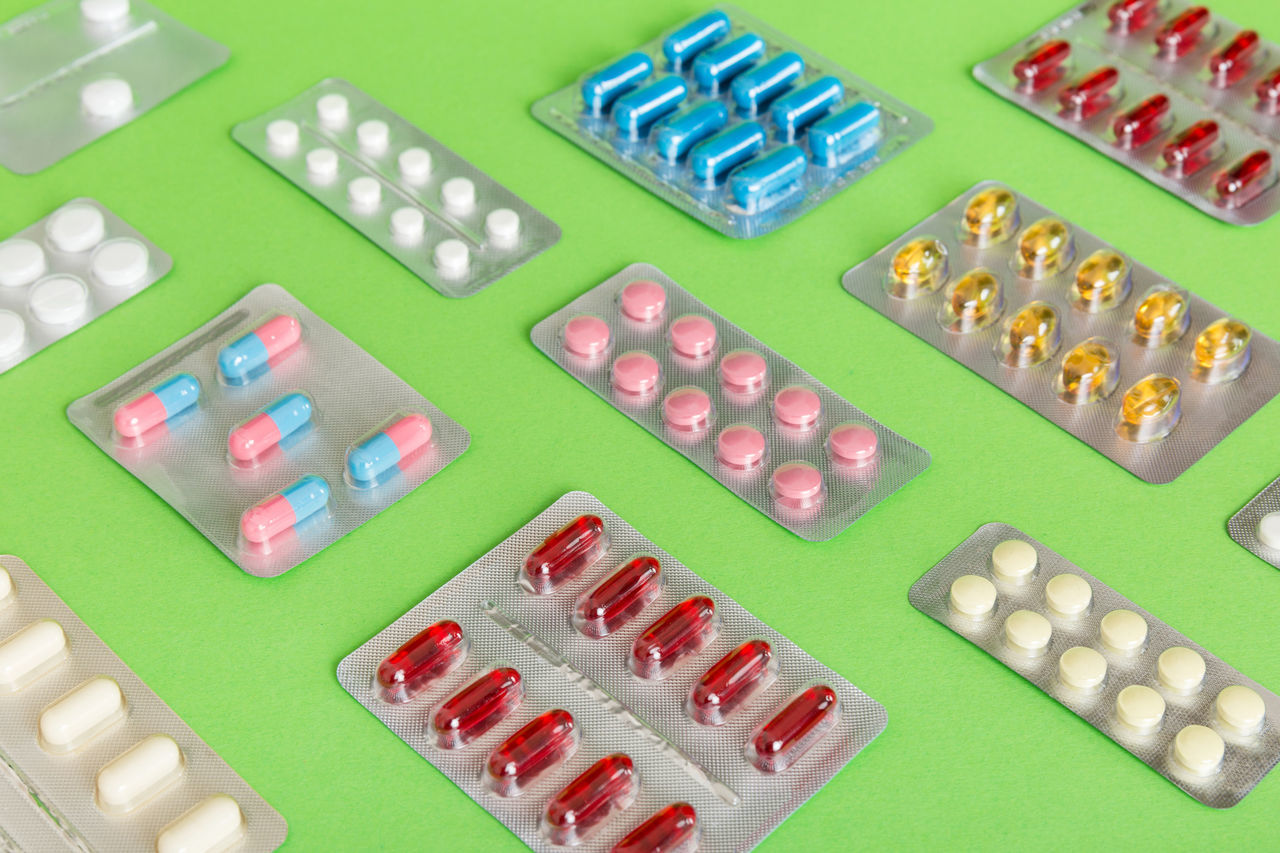 green, pill, medicine, no people, dose, large group of objects, healthcare and medicine, technology, capsule, in a row, high angle view, pharmaceutical drug, multi colored, blister pack, indoors