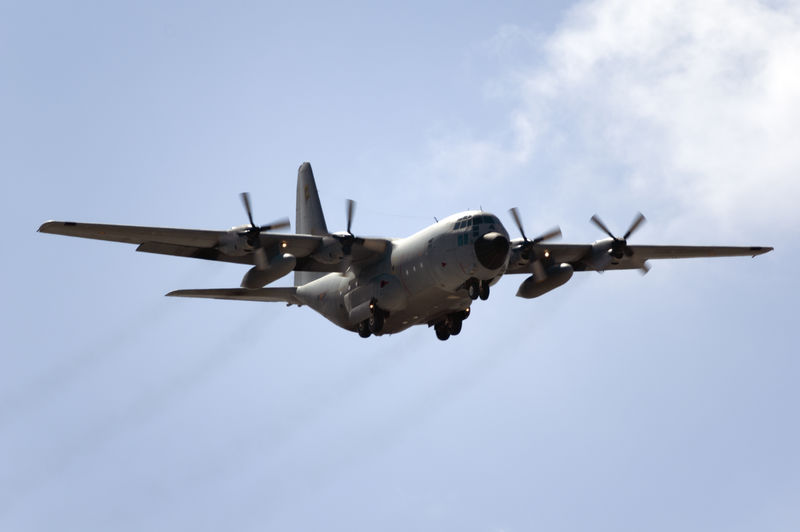 Low angle view of airplane flying against clear sky