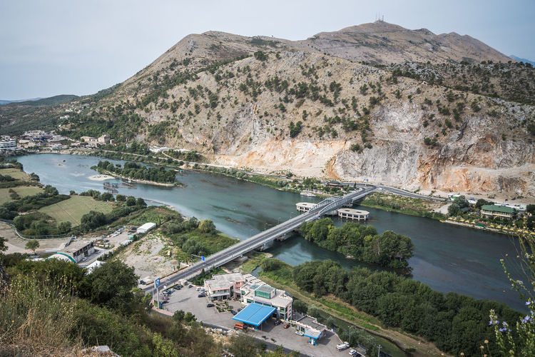 High angle view of bridge over bojana river against mountain