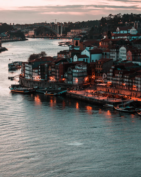 Scenic view of city by sea against sky during sunset porto