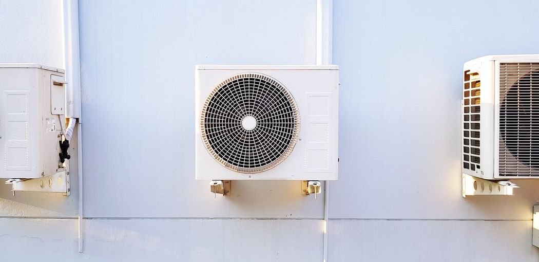 Directly below shot of electric fan on wall
