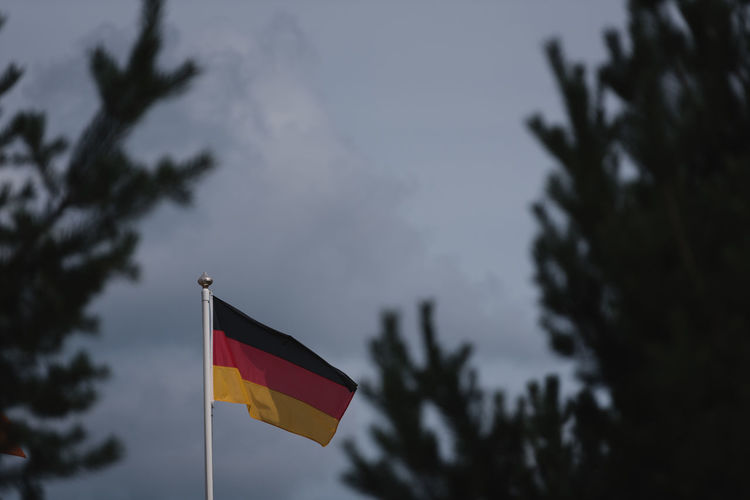 Low angle view of flag against sky
