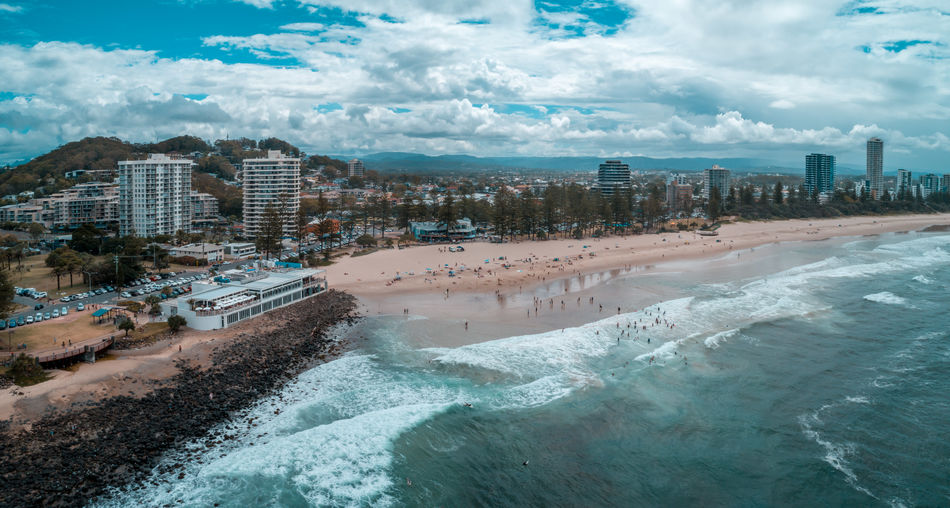Aerial panorama of beach cafe and people enjoying the beach at burleigh heads, queensland, australia