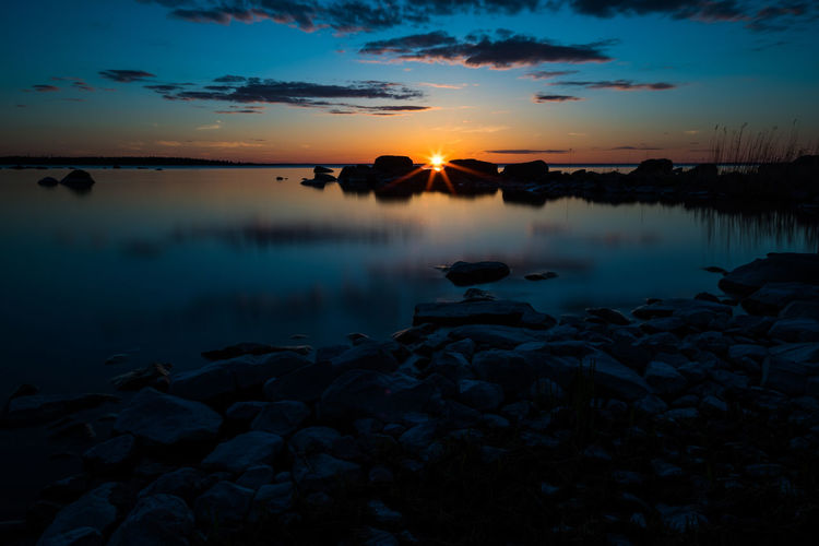 Scenic view of lake against sky during sunset