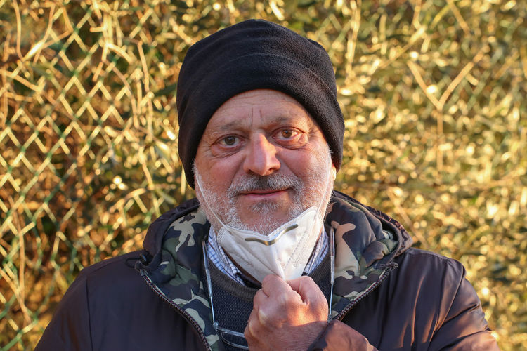 Portrait of man wearing hat outdoors