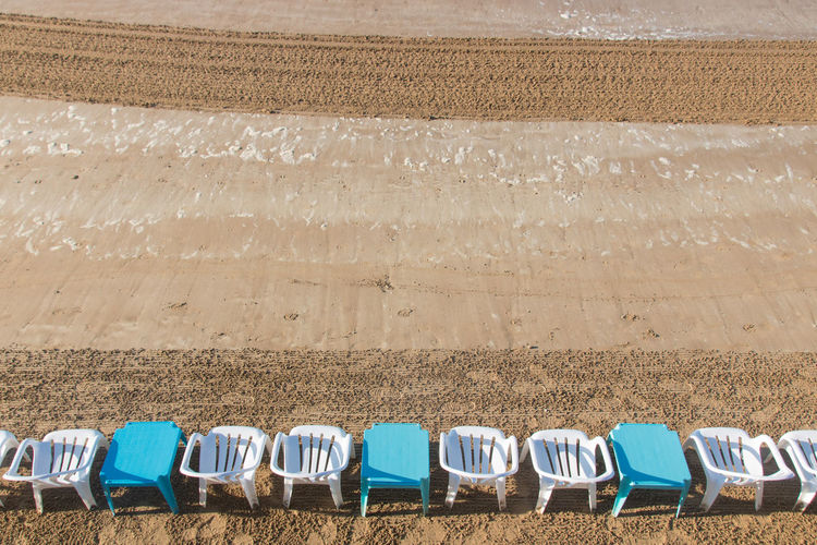 Sandy beach of sables d'olonnes in vendée in summer with empty chairs
