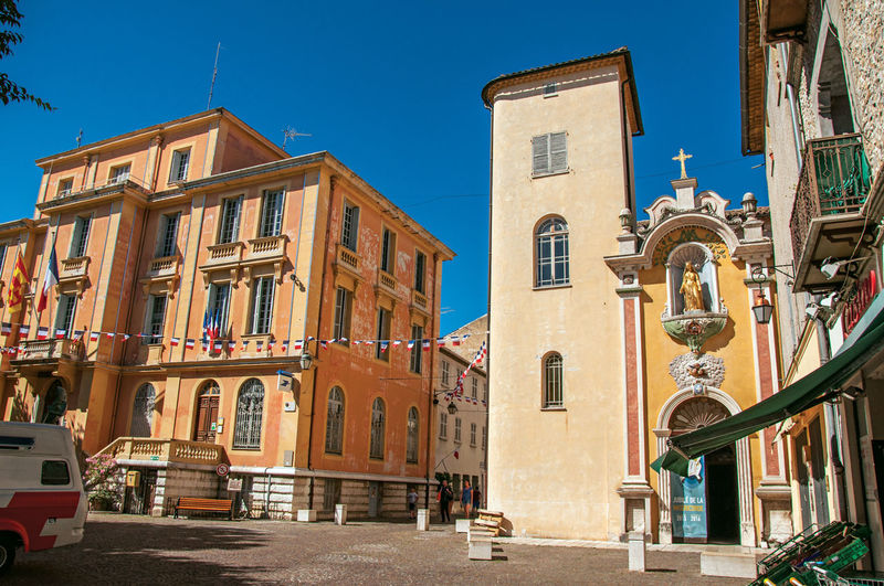 View of the city hall building and church in vence, in the french provence.