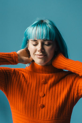 Adult Adults Only Bangs Beautiful Woman Blue Close-up Colored Background Content Day Dreaming Eyes Closed Fringe Happy Joy One Person One Woman Only One Young Woman Only Only Women Orange Color People Relaxed Smiling Studio Shot Young Adult Young Women Place Of Heart The Portraitist - 2017 EyeEm Awards Out Of The Box Live For The Story Sommergefühle EyeEm Selects Capture Tomorrow
