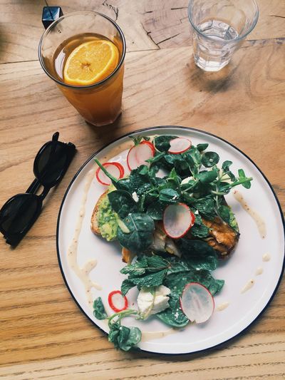 High angle view of  avocado and mackerel bruschetta breakfast served on table