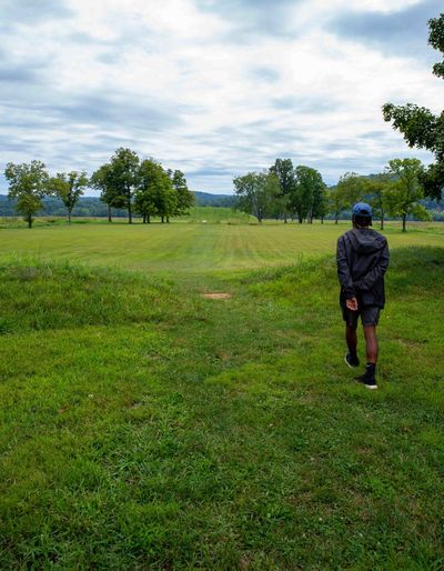 Young man at large native american burial mound at seip earthworks ohio