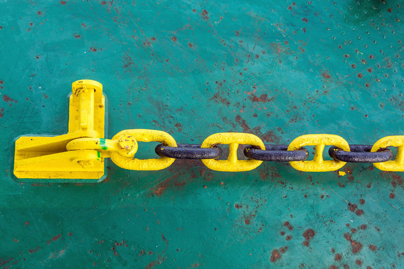 Mooring anchor chain secured to a stopper pin on board a construction barge at offshore oil field