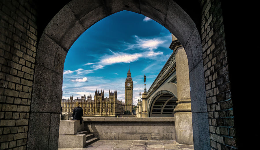 Historic big ben against sky seen from archway