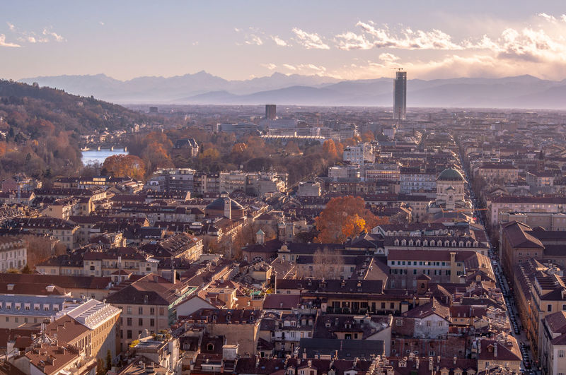 High angle view of city against sky during sunset