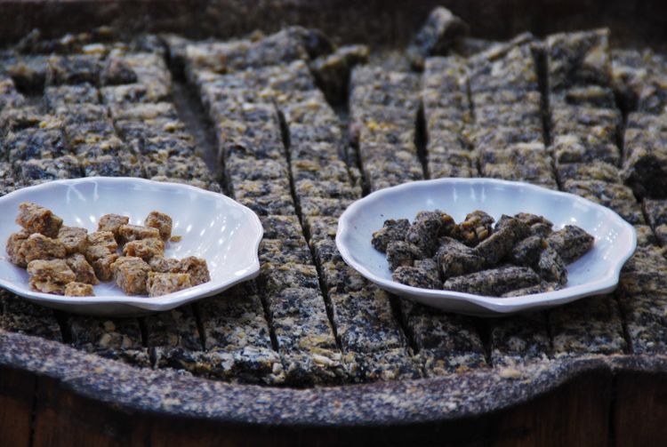 Close-up of snacks in plates at street market stall