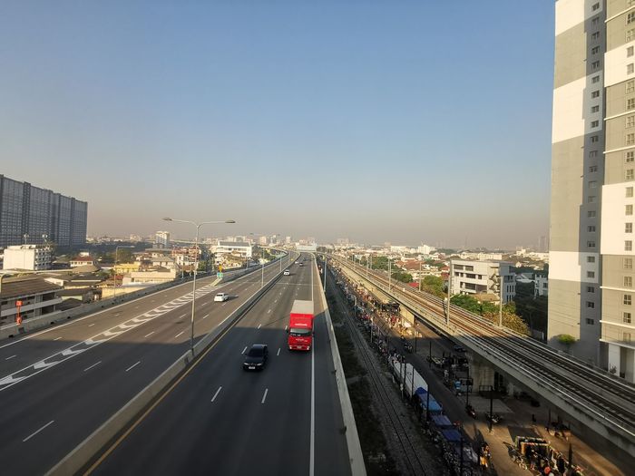 High angle view of highway in city against clear sky