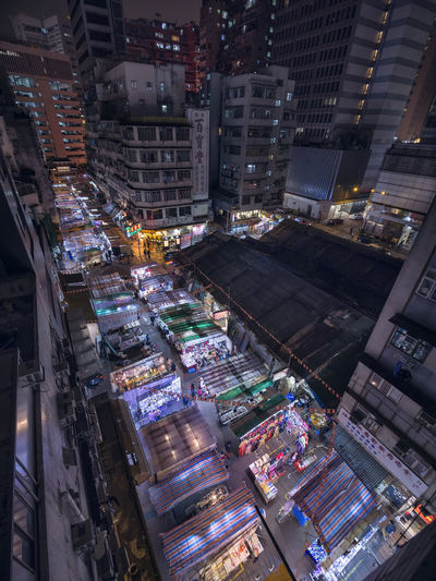High angle view of illuminated buildings in city