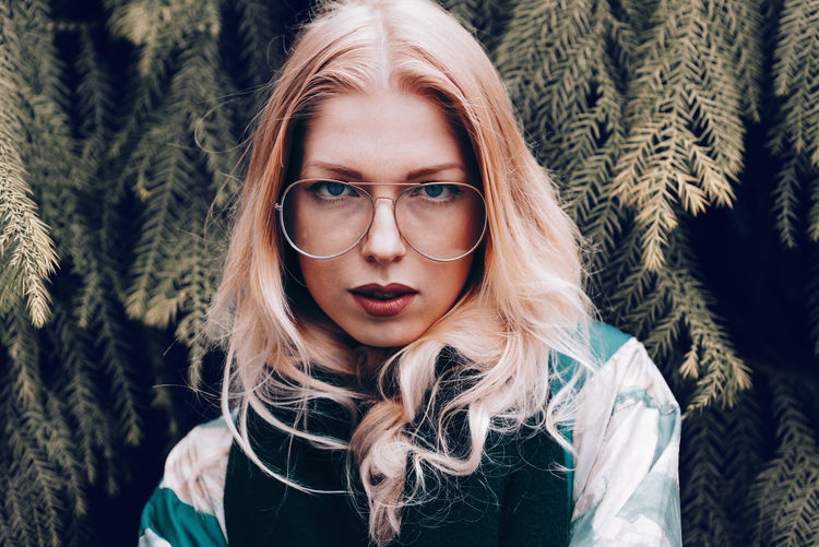 Young women wearing vintage glasses Adult Cool EyeEm Best Shots EyeEm Gallery Fashion Glasses Leipzig Lifestyle Looking At Camera Millenials Portrait Of A Woman Retro Tree Background Blond Hair Face Germany Long Hair Model Vintage Women Women Around The World Young Adult Fashion Stories