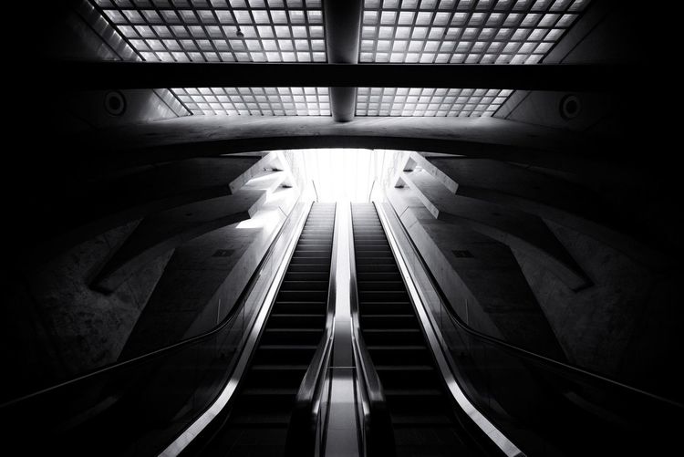 Low angle view of illuminated escalator