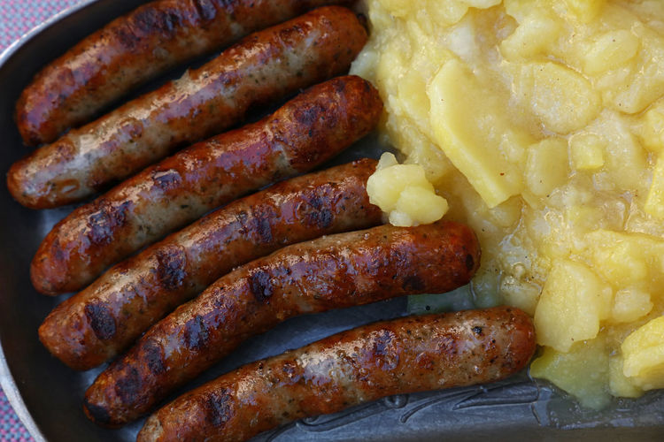 Close-up of fried sausages mashed potatoes