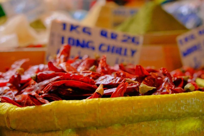 Close-up of red chilis for sale at market stall