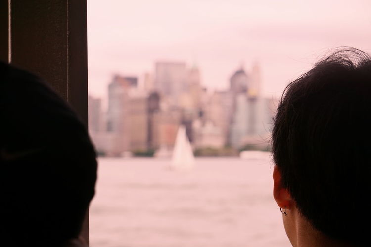 Rear view of people on ferry