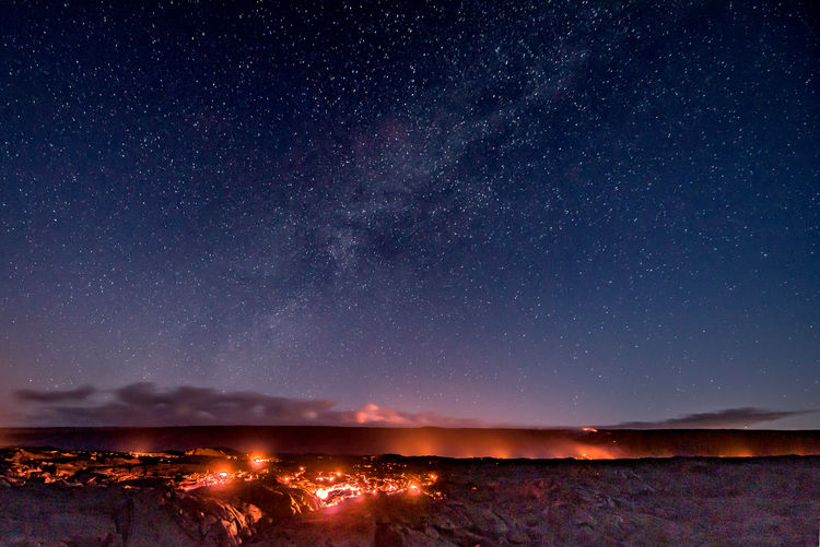 Scenic view of volcano eruption sky at night