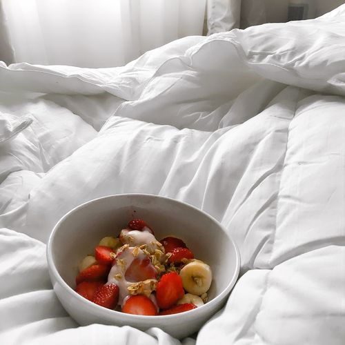 High angle view of breakfast in bowl on bed