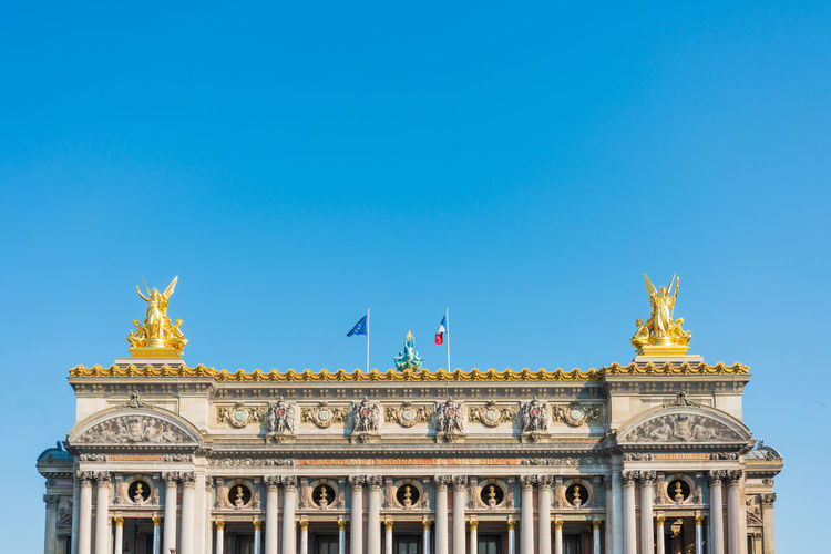 Low angle view of historical building against blue sky