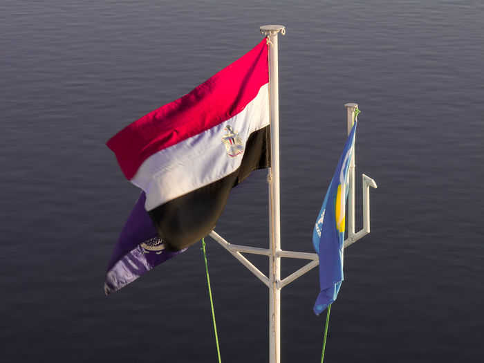 Close-up of flag on boat in lake