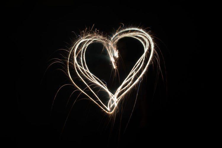 Heart shape made from light painting against black background