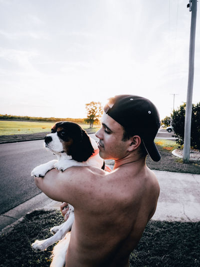 Side view of man with dog 