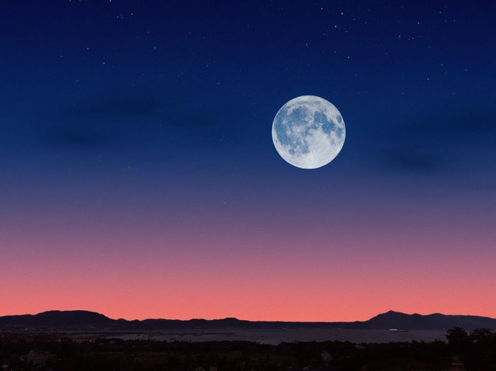Scenic view of moon against sky at night