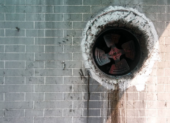 Dirty exhaust fan on wall