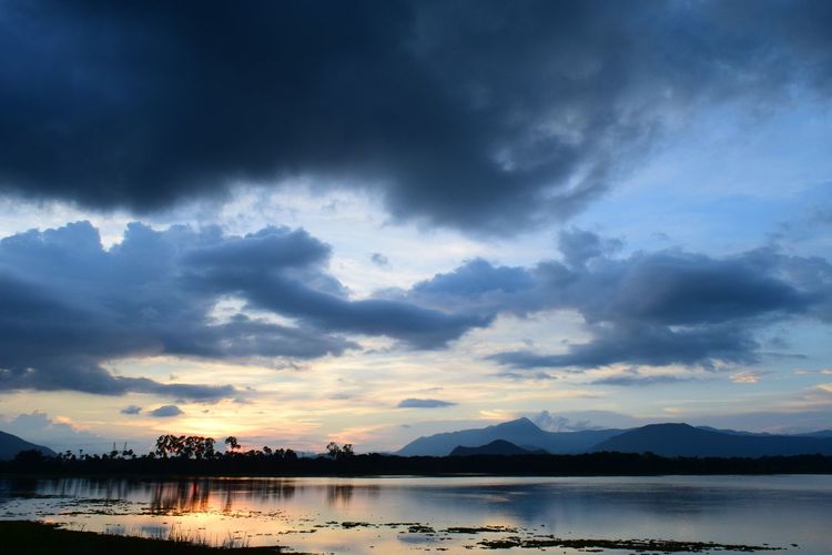 Scenic view of lake against sky during sunset