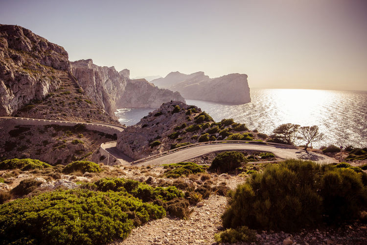 Scenic view of a winding road bevor the sea against clear sky, cap formentor