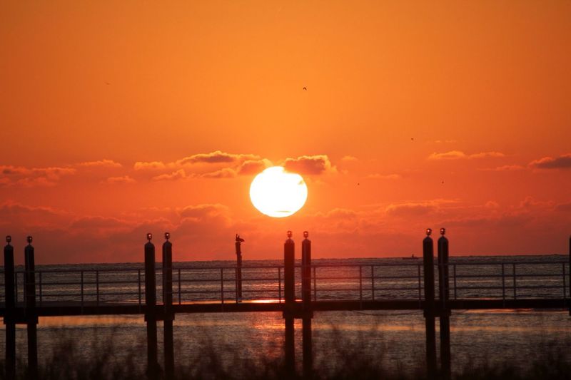 Scenic view of sea at sunset