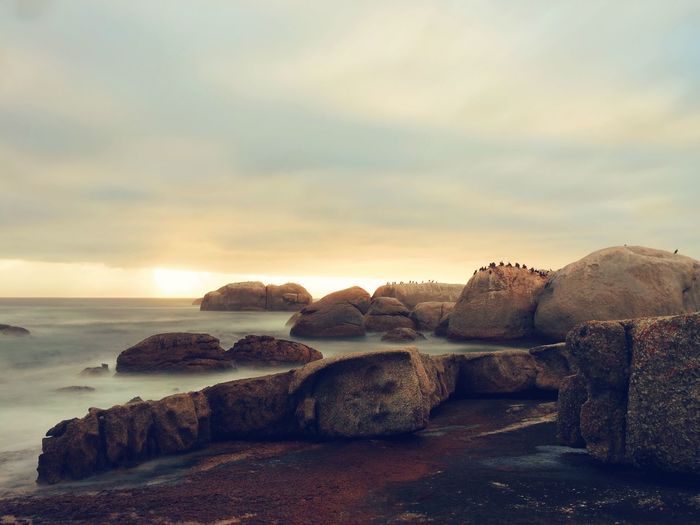 Scenic view of sea against cloudy sky