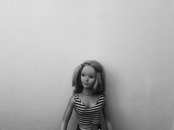 Close-up of doll against wall