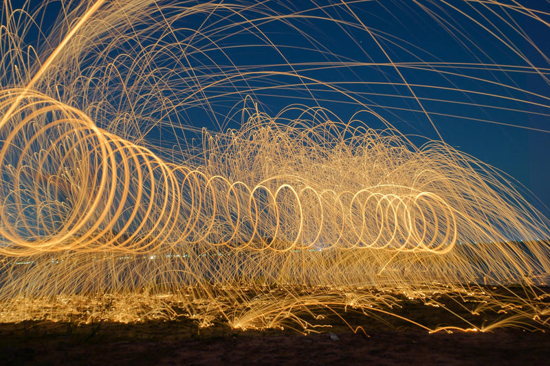 Light trails against sky at night