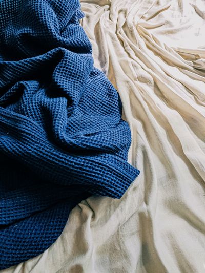 High angle view of textile on bed