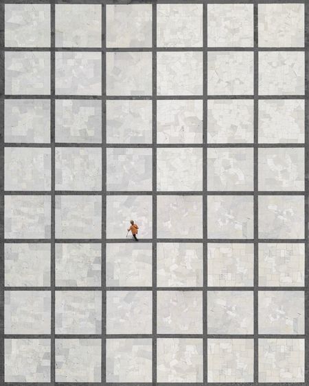 Aerial view of woman walking on tiled floor