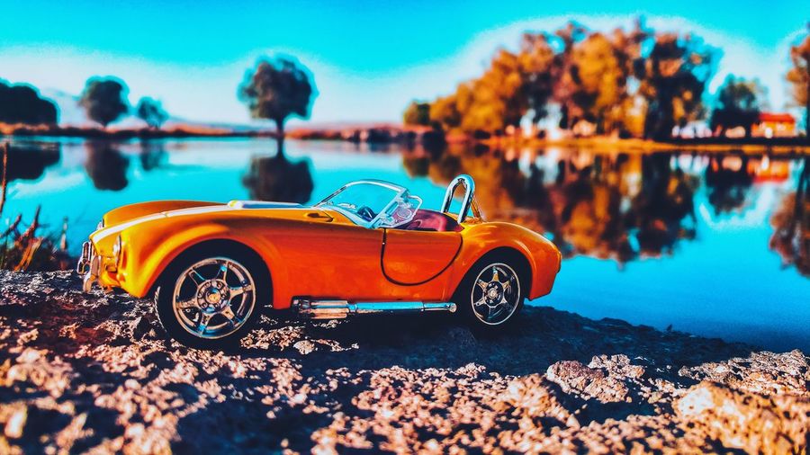 Close-up of vintage car against blue sky