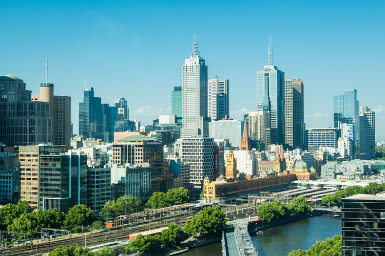 Modern buildings in city against sky